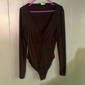 Black low neckline body suit